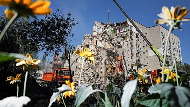 Ukrainian rescuers clear rubble as Kyiv mourns 30 killed in Russian attack