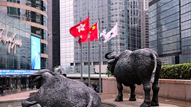 Shares edge higher in Asia as oil dips, earnings loom