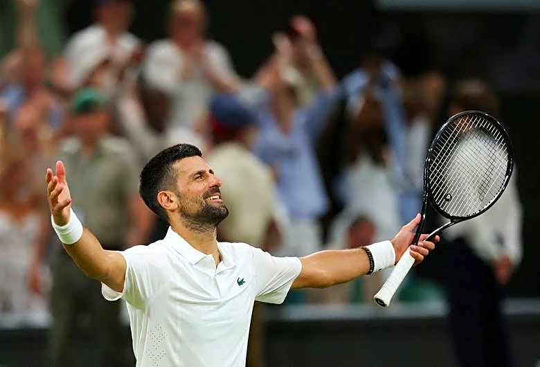 Tennis-Djokovic tames Auger-Aliassime and returns to Wimbledon semis for Sinner showdown