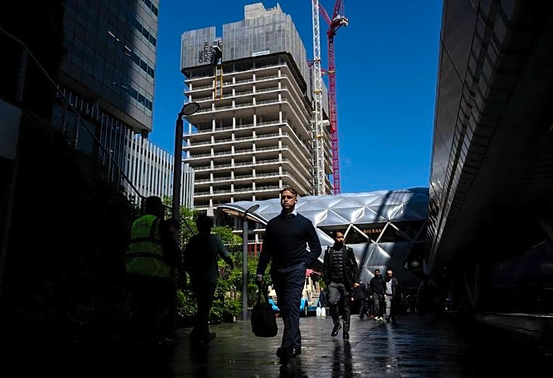UK jobs market downturn eases as pay pressure pick up, survey shows
