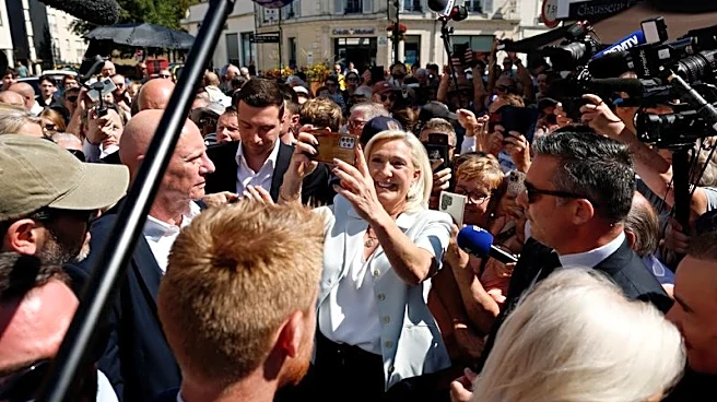 Cheers and boos for Le Pen's French campaign launch after guilty verdict