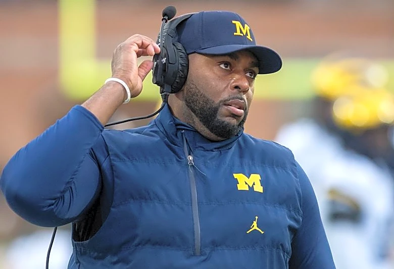 Report: Michigan AD warned coach not to travel with staffer