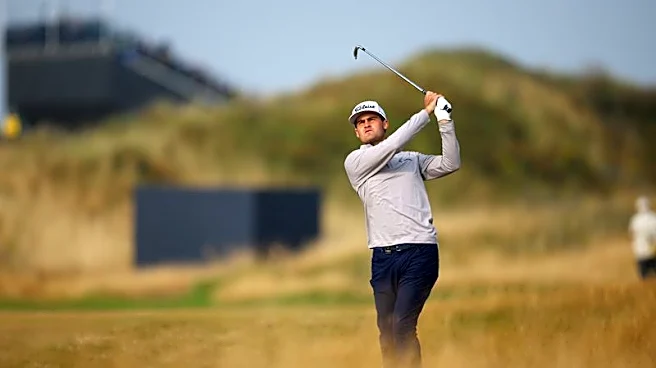Golf-Australian Herbert moves top of Open leaderboard with birdie blitz