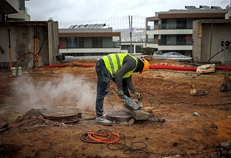 Analysis-Portugal's migrant curbs hit construction firms working to solve housing crisis