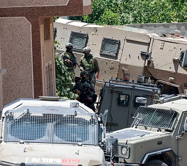 Israeli troops round up Palestinians in West Bank village after shootout involving settlers