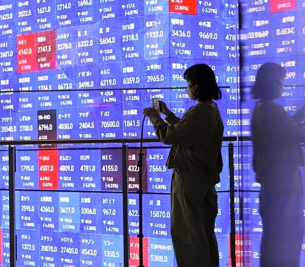 Stocks climb as Amazon, Microsoft results reignite AI trade, yen swings