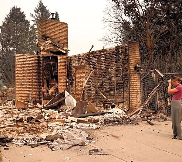 Wildfires near Spokane destroy more than 700 buildings, force 64,000 to flee