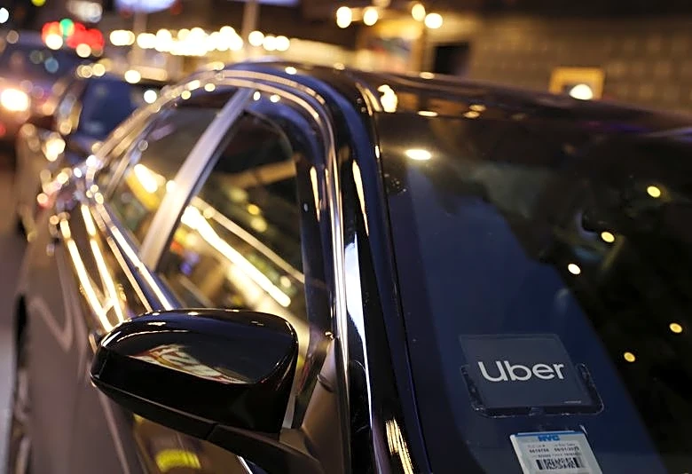 Uber forecasts weak quarterly profit, doubles down on robotaxi investment plans