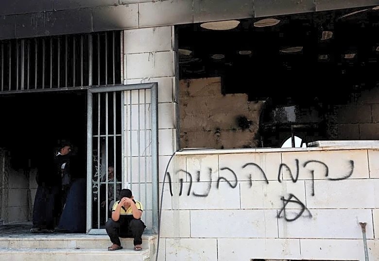 Israeli troops clash with settlers besieging Palestinian homes in West Bank
