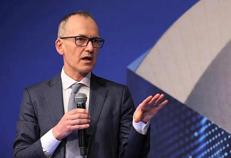 Australia central banker says rate risks are skewed higher