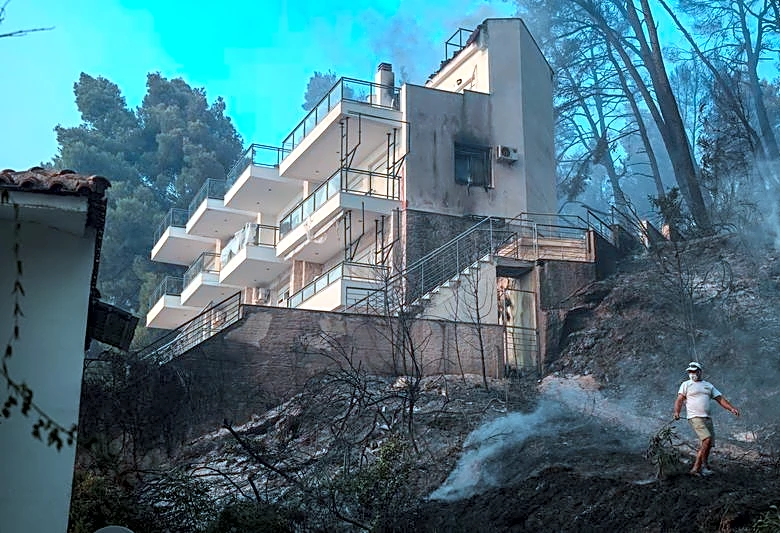 Tourists flee as Greek wildfire hits resort; Croatia also fights blaze