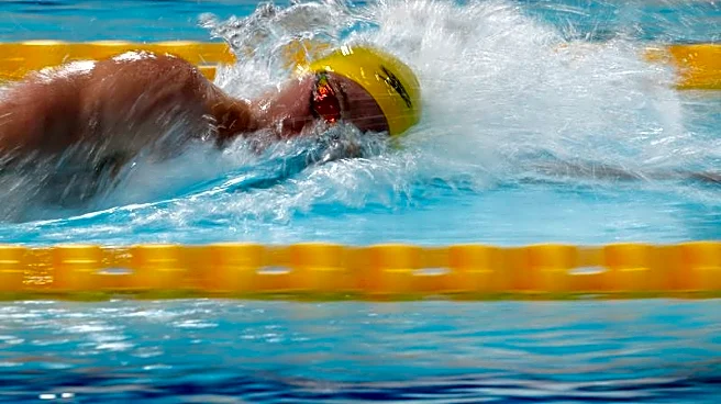Swimming-Short breaks Thorpe record as Australia sweeps 400m freestyle golds at Pan Pacific