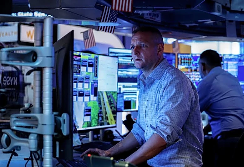Shares steady, dollar slips as markets pare Fed rate risks