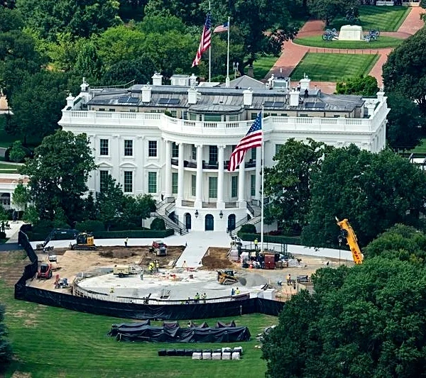 Trump the builder carves his legacy in stone as pressures mount