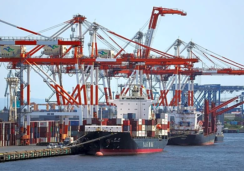 Japan's exports surge on chips demand, imports hit record on oil costs