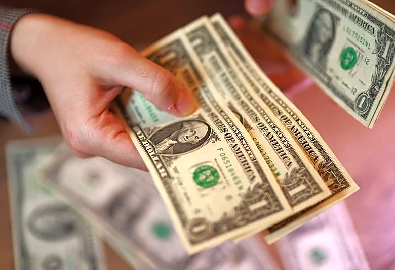 Dollar hits 3-month low vs euro, pares losses after Treasury move