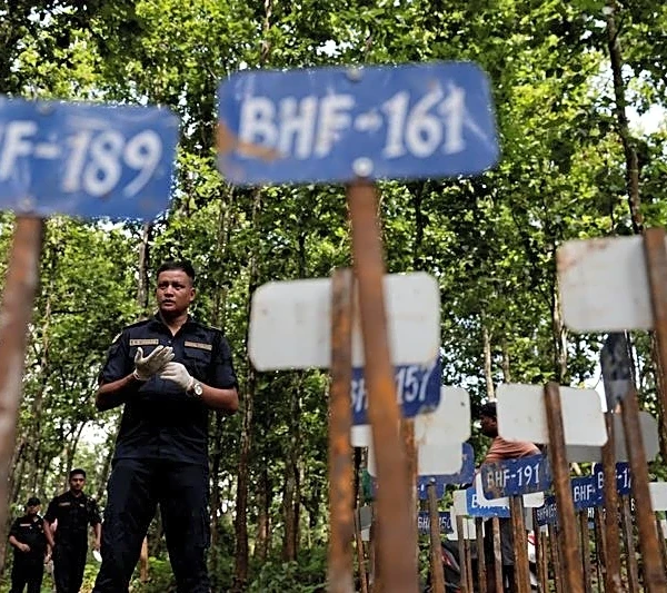 Nepal begins mass burials of unidentified flood victims as families seek missing