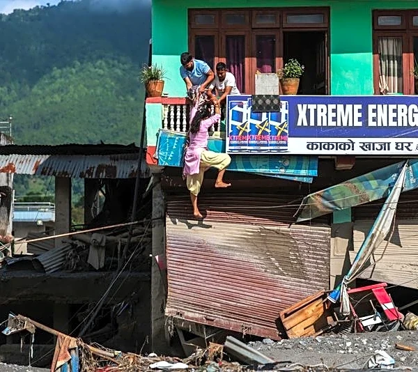 Rescuers battle floods and debris as Himalayan disaster death toll nears 800