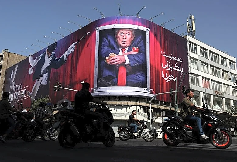 Trump aides, fearing a midterm rout, push to keep Iran war 'quiet' for now