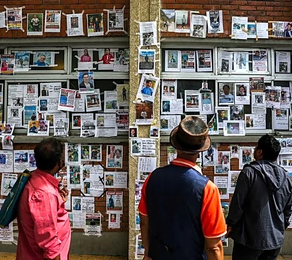 Nepalis pin hopes on 'wall of the missing' in hunt for relatives after deadly flood