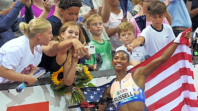 Athletics-American hurdler Russell senses more to come after world record