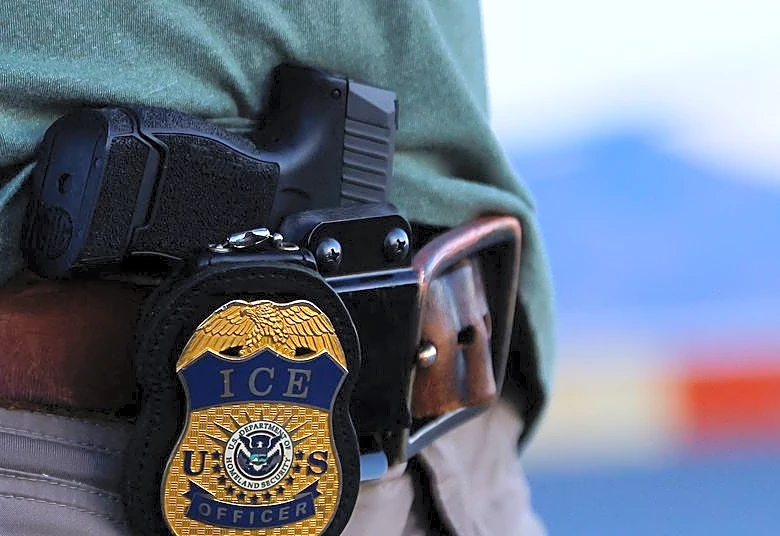 ICE agent charged with lying over Minnesota shooting, source says