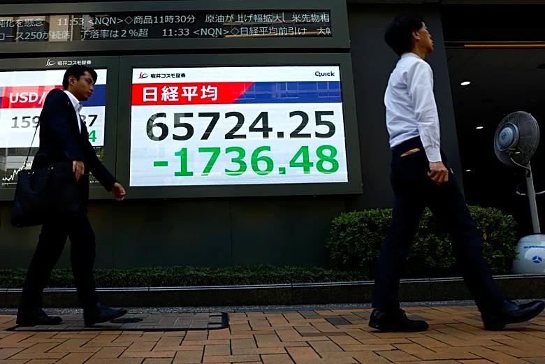 Asia stocks waver as yen surges, Iran warns of retaliation
