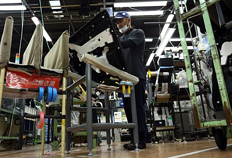 Japan manufacturers' mood hits near 5-year high on semiconductor demand: Reuters poll