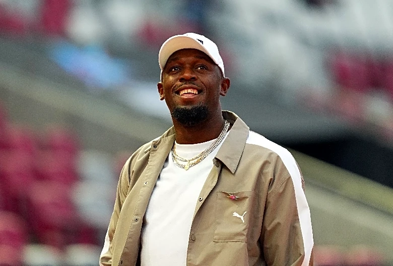 Athletics-Bolt unfazed by robot's record run, eyes Manchester derby instead