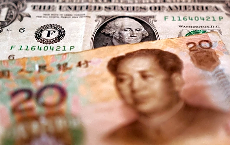 China urges more FX hedging as strong yuan hits exporters, sources say