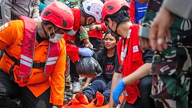 Families desperate for news as 129 still missing four days after capsize of ship in Indonesia's Java Sea