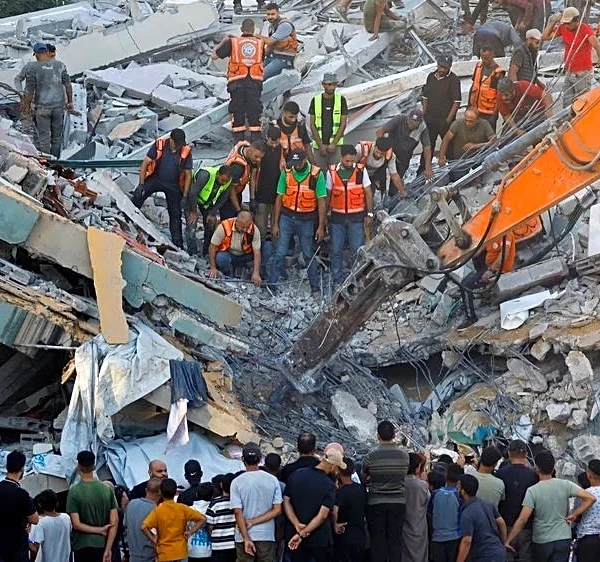 War-damaged Gaza building collapses, killing 20 people sheltering inside