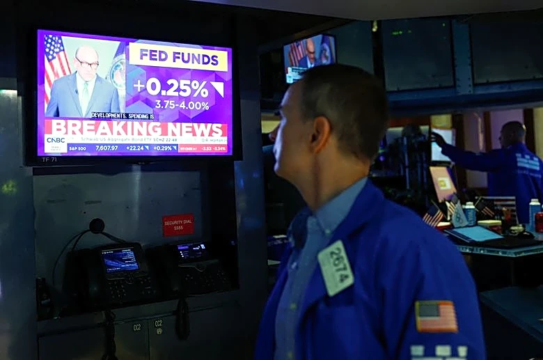 Wall St ends lower after Fed hikes interest rates, sees more tightening ahead