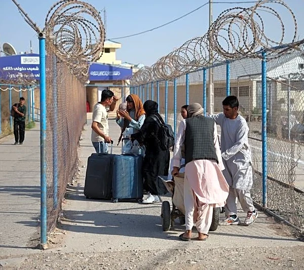 Impoverished by war in Iran, Afghan migrants return to Taliban rule