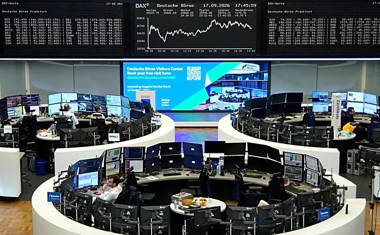 European shares tick lower on telecoms weakness, but poised for weekly gains