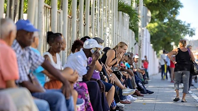 As lines grow at banks, Cuba tiptoes away from communism but stability seems distant