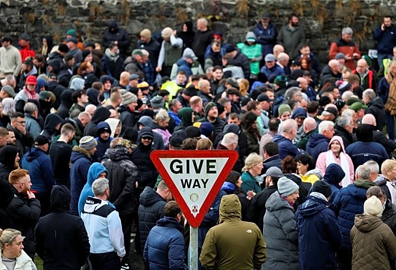 Protesters block Orange Order from marching through Catholic area in Northern Ireland