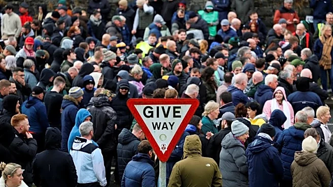 Protesters block Orange Order from marching through Catholic area in Northern Ireland