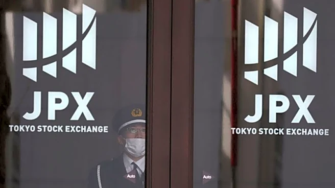 Stocks slip in Asia as oil climbs, bonds retreat