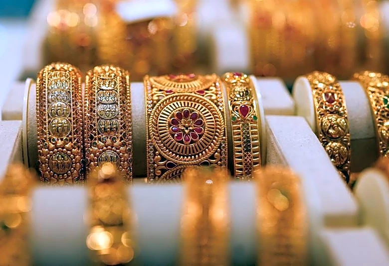 Gold's lustre dims as Treasury yields surge, markets bet on higher Fed rates