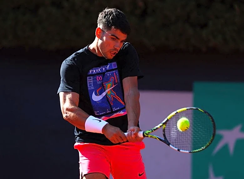 Tennis-Alcaraz overcomes teething trouble on tweaked serve to beat Michelsen in Tokyo
