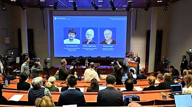 German and US scientists win Nobel medicine prize for work on light and brain