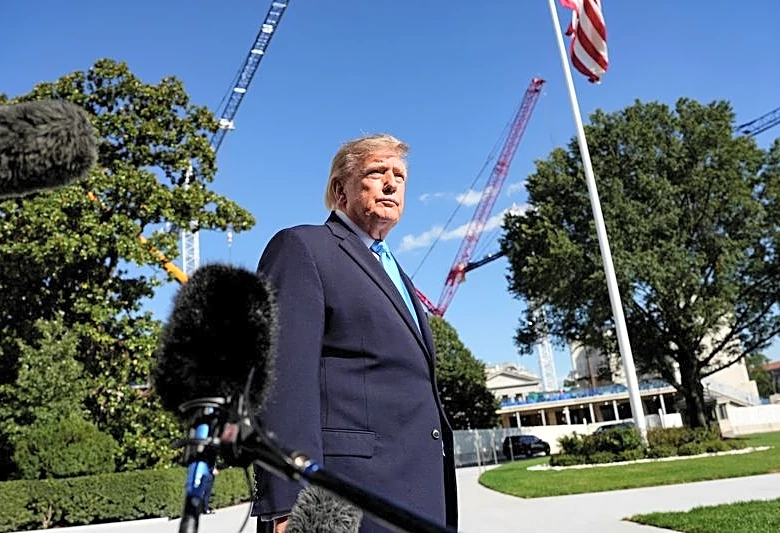 Trump urges supporters to vote by mail despite fraud claims