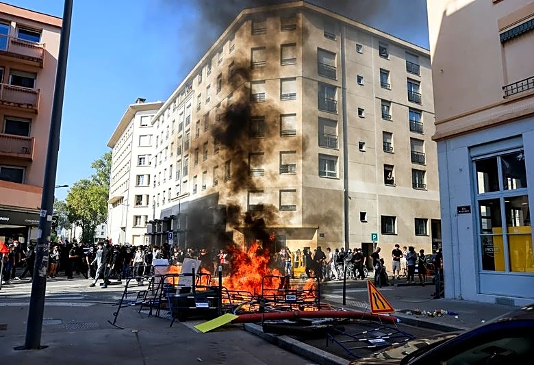 Police fire teargas at French protesters on biggest day of school demonstrations