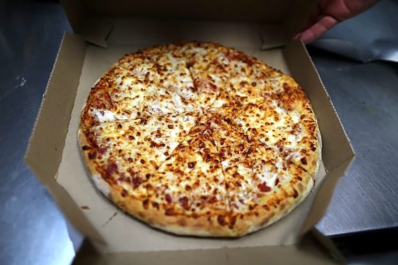 Domino's forecasts muted annual same-store sales as competition, cautious consumers weigh on demand