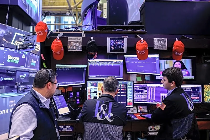 Dollar jumps, stocks and bonds dented by hot US inflation data
