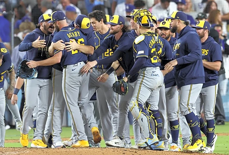 Baseball-Experts divided on whether Dodgers' sweep shifts MLB salary cap fight