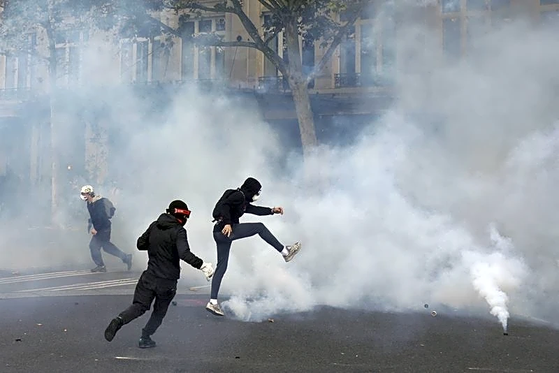 French police clash with protesters as tens of thousands rally over cost of living