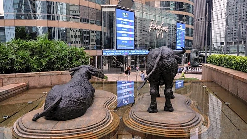 Asian stocks slip, Wall St and bonds benefit from oil skid