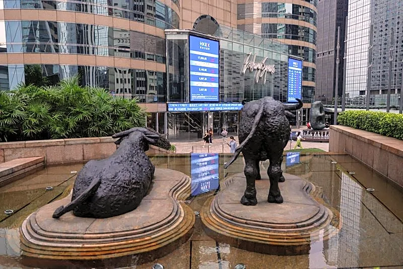 Asian stocks slip, Wall St and bonds benefit from oil dip